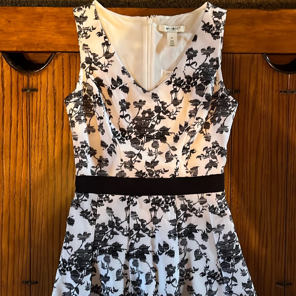 White House Black Market dress with floral design and pleat details.